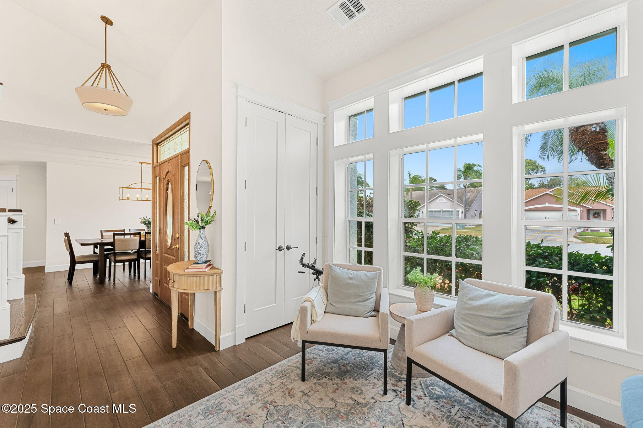 2525 Forest Run Drive Melbourne, FL 32935 - Photo 6 of 36 a living room with furniture and a large window