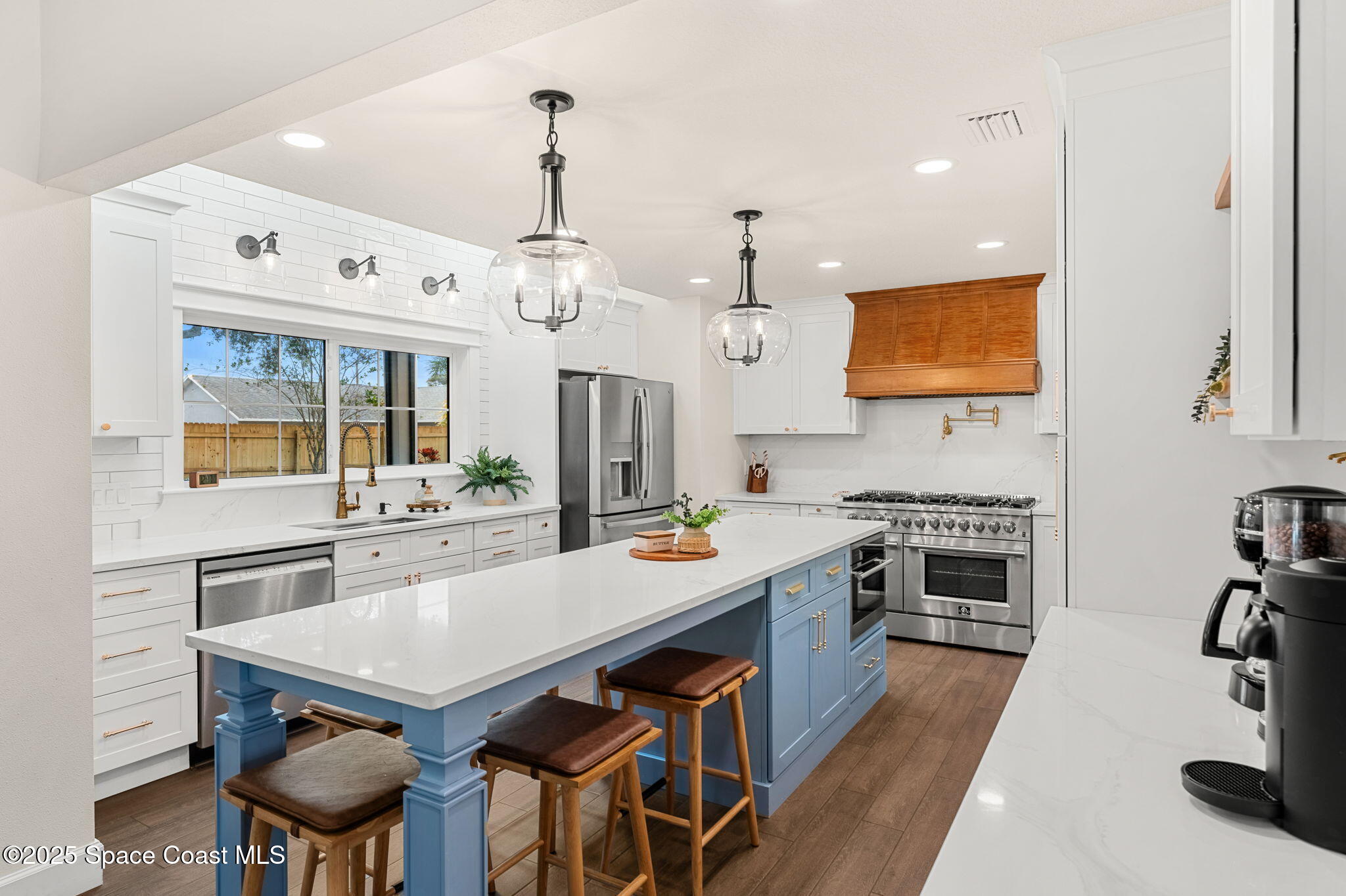 2525 Forest Run Drive Melbourne, FL 32935 - Photo 10 of 36 a large kitchen with a table and chairs