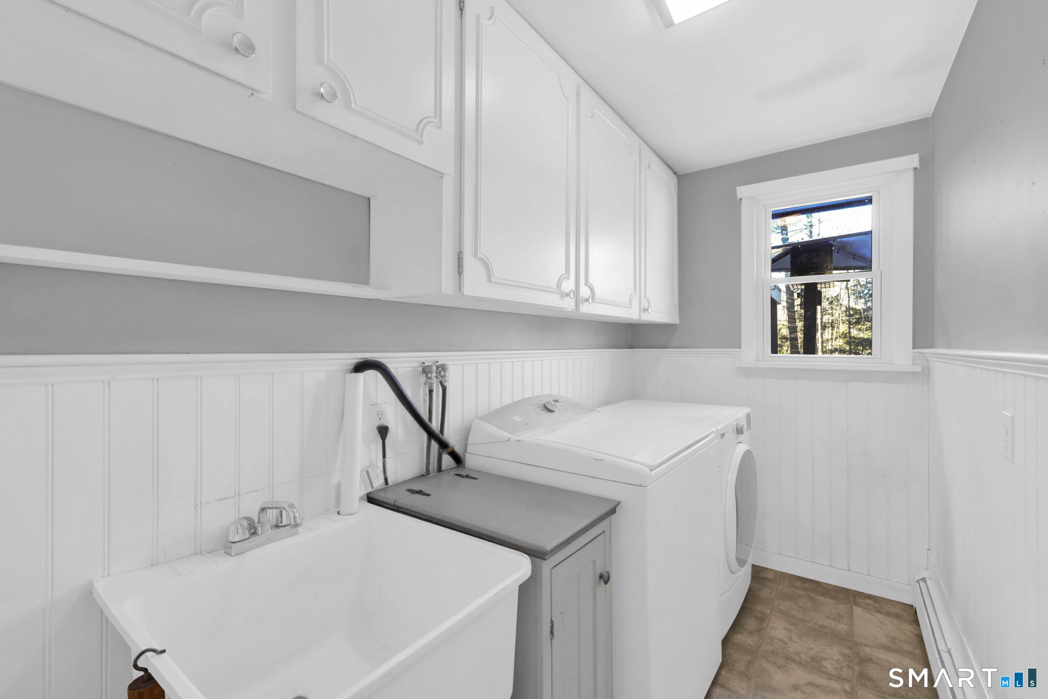 18 Racker Road Stafford, CT 06076 - Photo 14 of 38 a utility room with cabinets washer and dryer