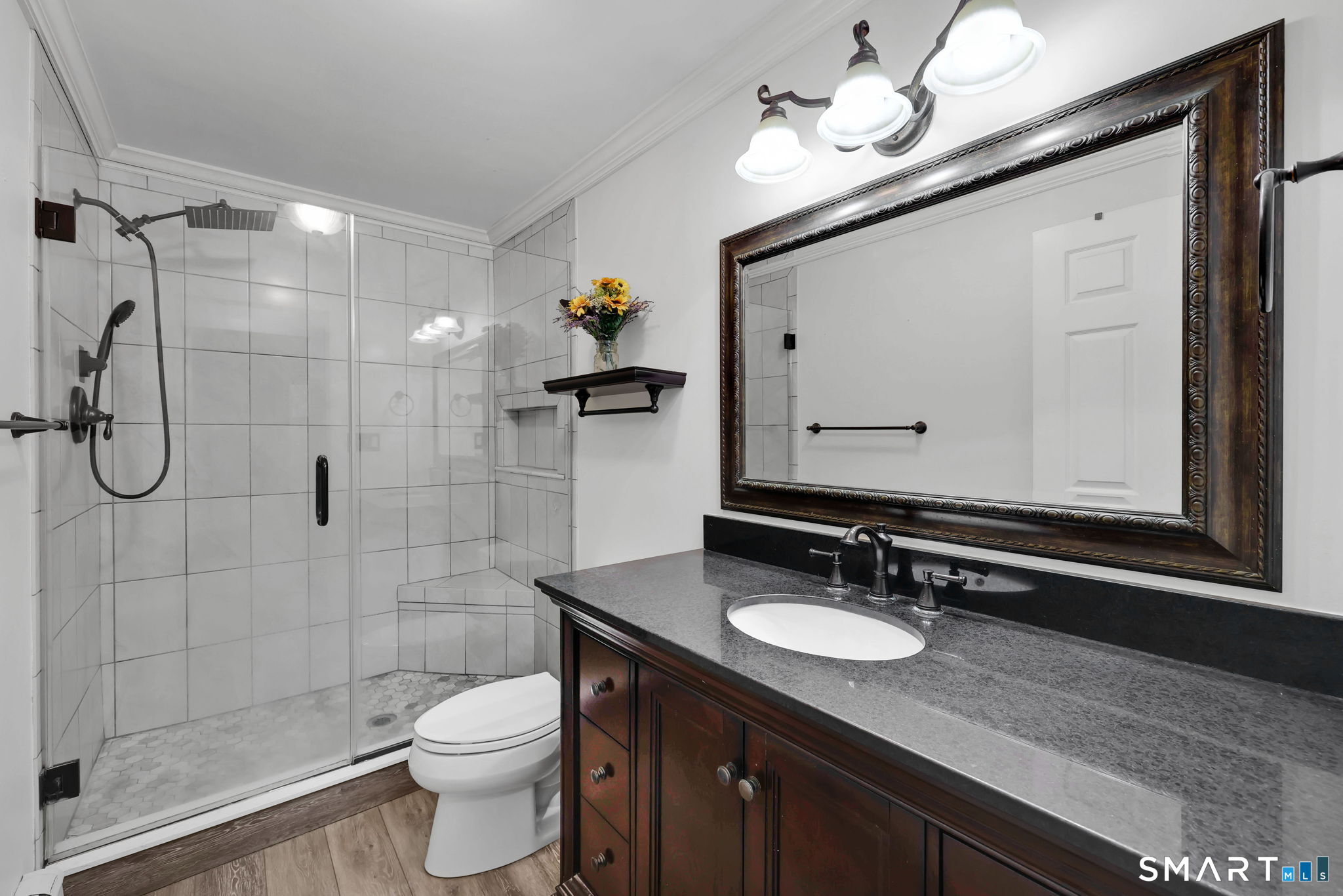 18 Racker Road Stafford, CT 06076 - Photo 17 of 38 a bathroom with a granite countertop sink toilet a mirror and shower