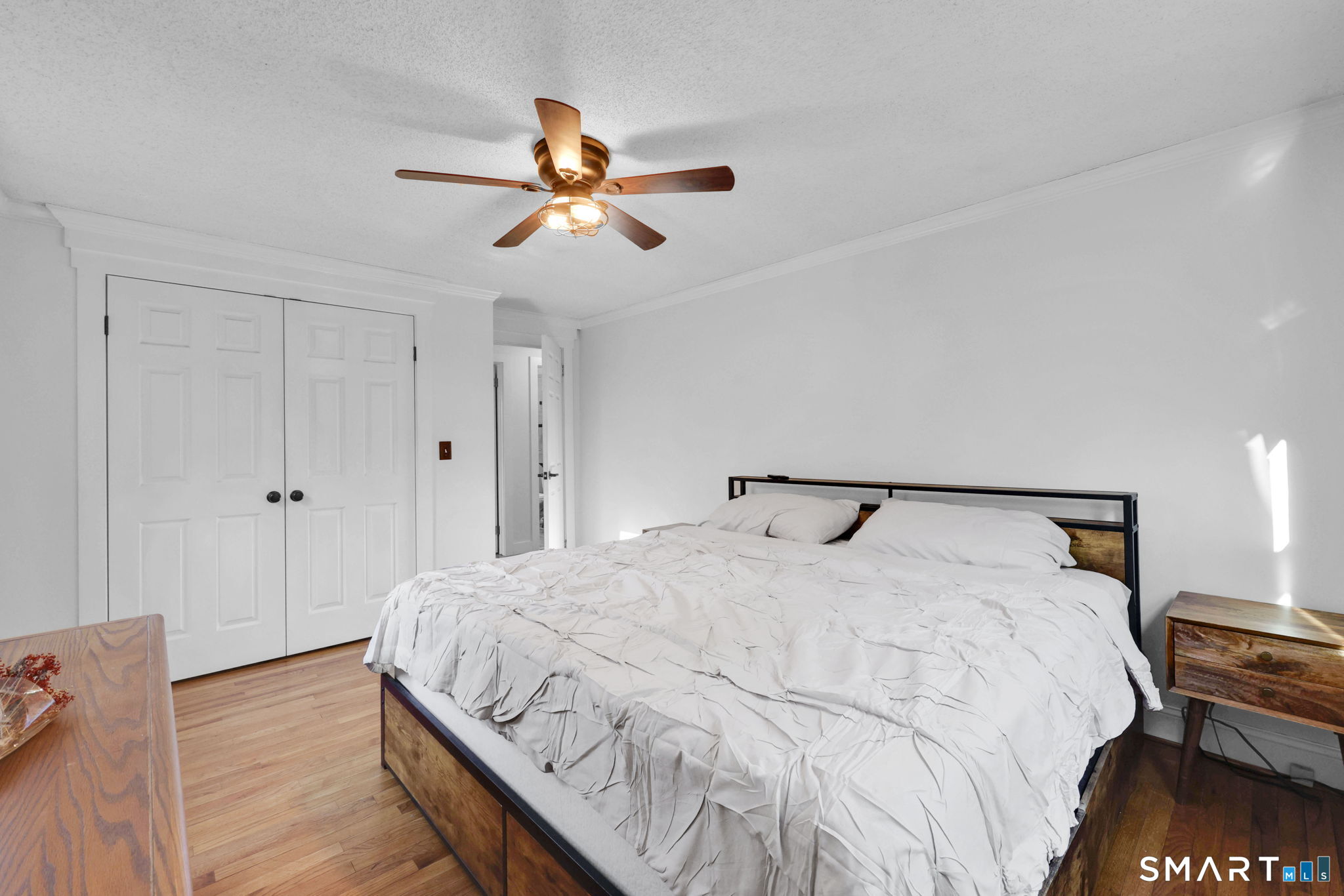 18 Racker Road Stafford, CT 06076 - Photo 20 of 38 a bedroom with a bed and a chandelier