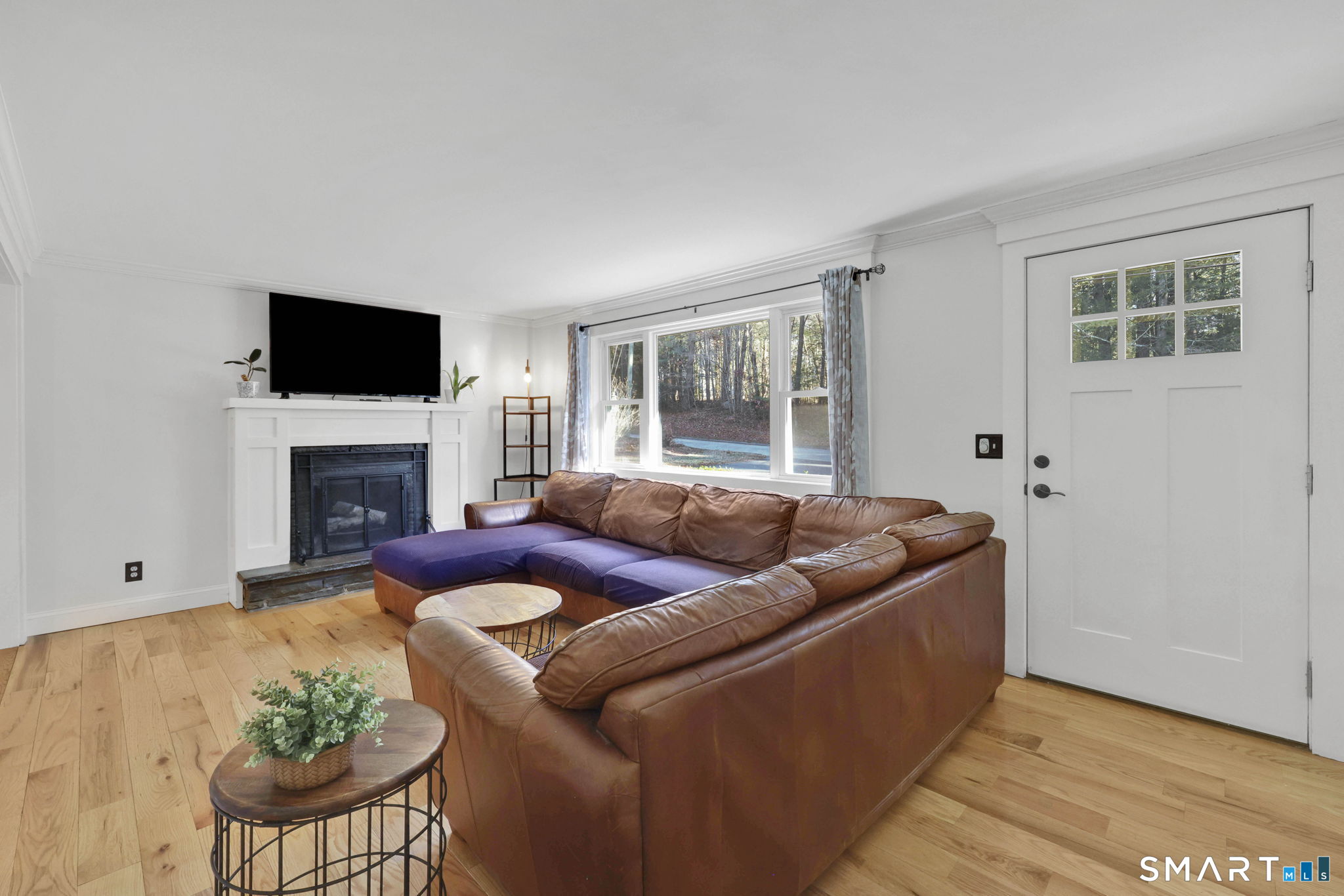 18 Racker Road Stafford, CT 06076 - Photo 2 of 38 a living room with furniture fireplace and flat screen tv