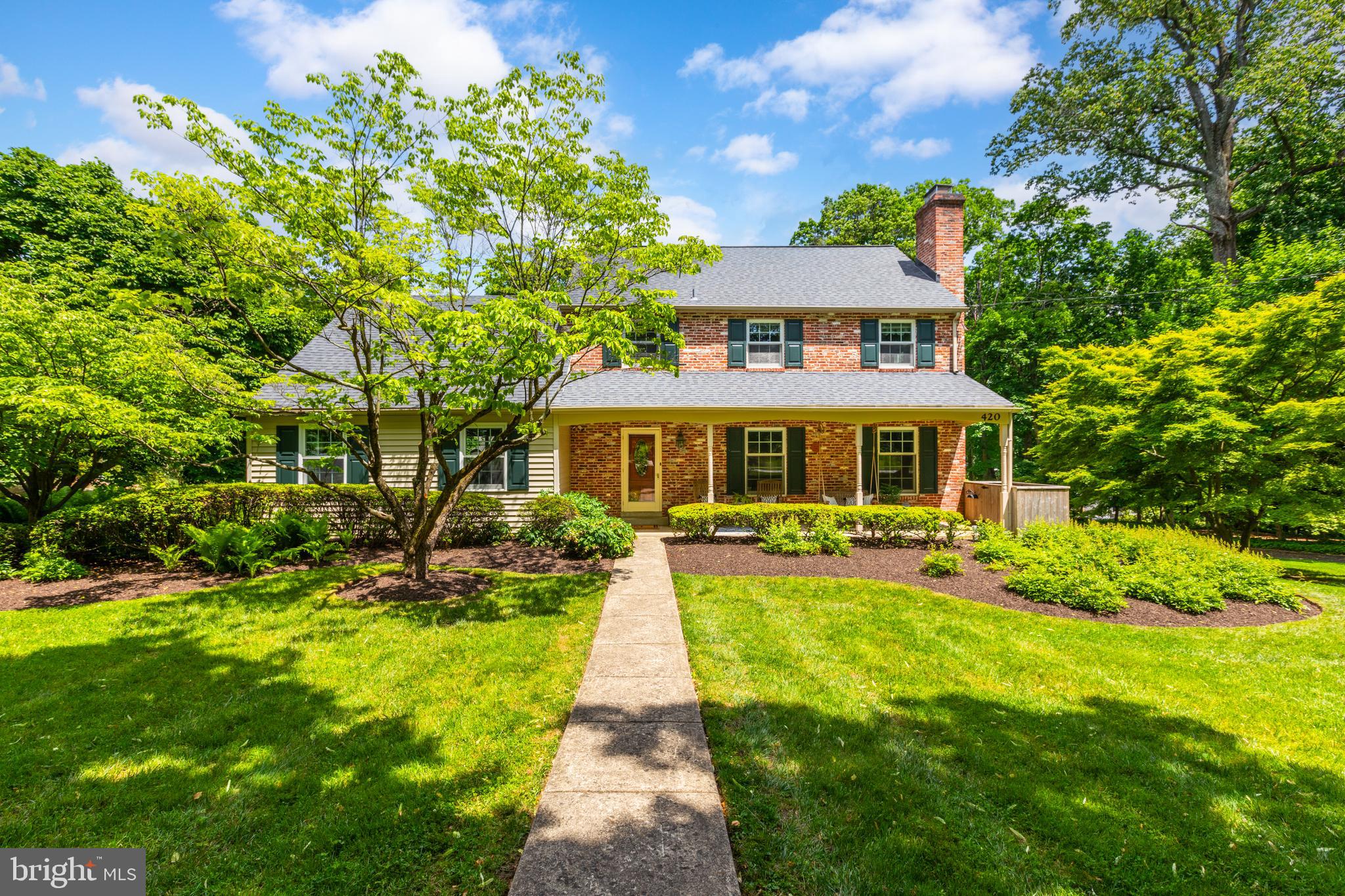 420 Accomac Road Wyncote, PA 19095 - Photo 2 of 82 a front view of a house with a yard table and chairs