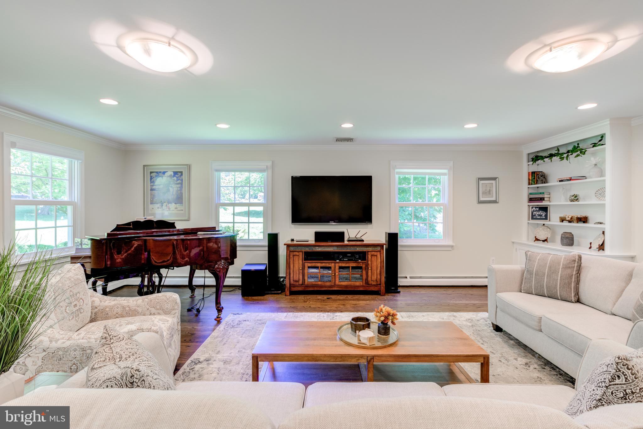 420 Accomac Road Wyncote, PA 19095 - Photo 27 of 82 a living room with furniture and a flat screen tv