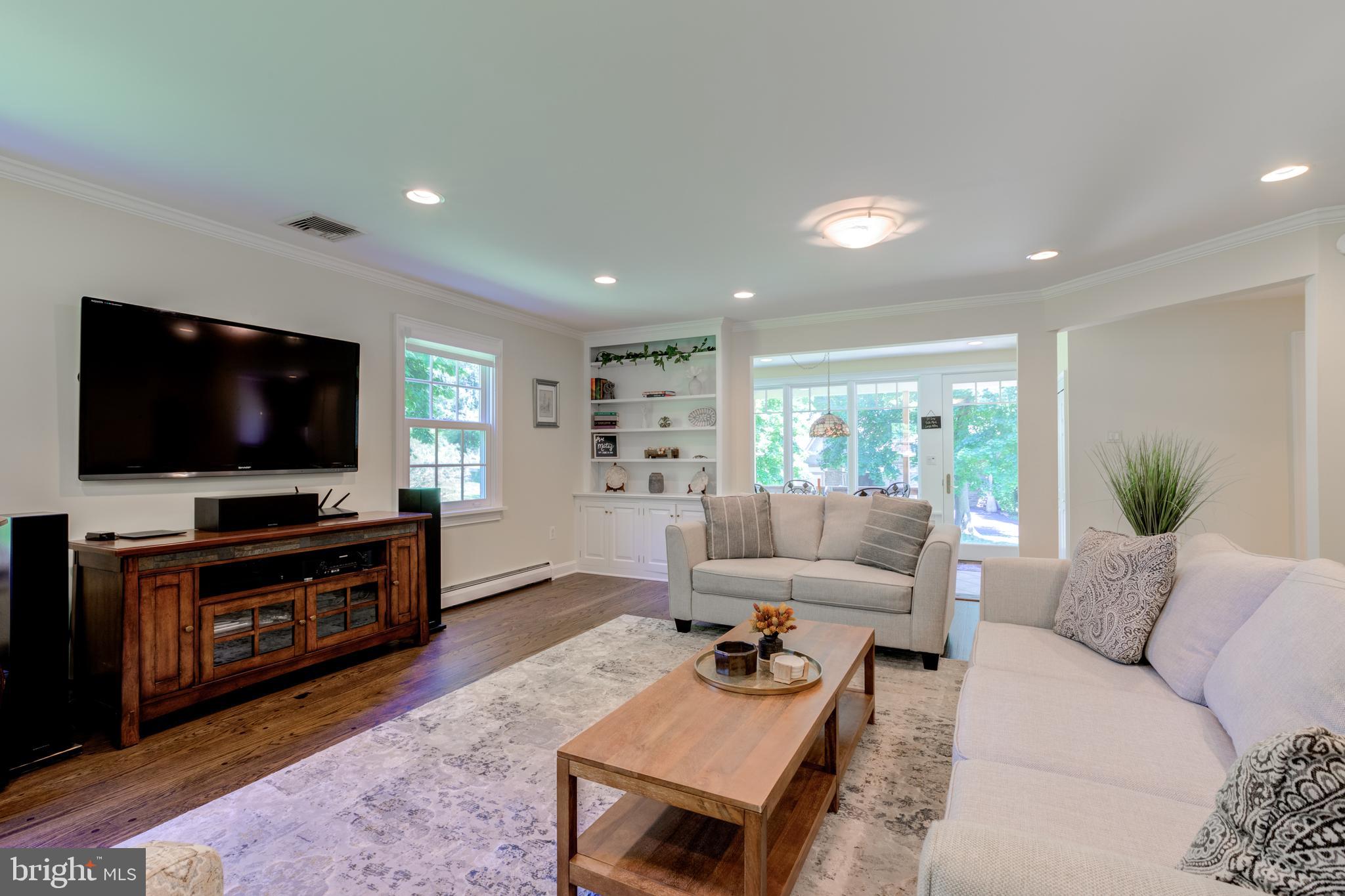 420 Accomac Road Wyncote, PA 19095 - Photo 30 of 82 a living room with furniture and a flat screen tv