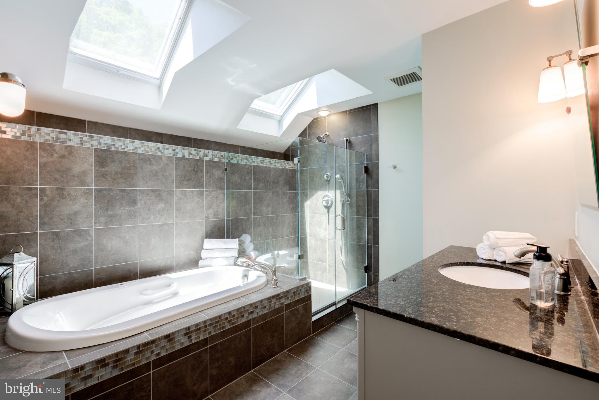 420 Accomac Road Wyncote, PA 19095 - Photo 35 of 82 a bathroom with a granite countertop sink toilet and shower