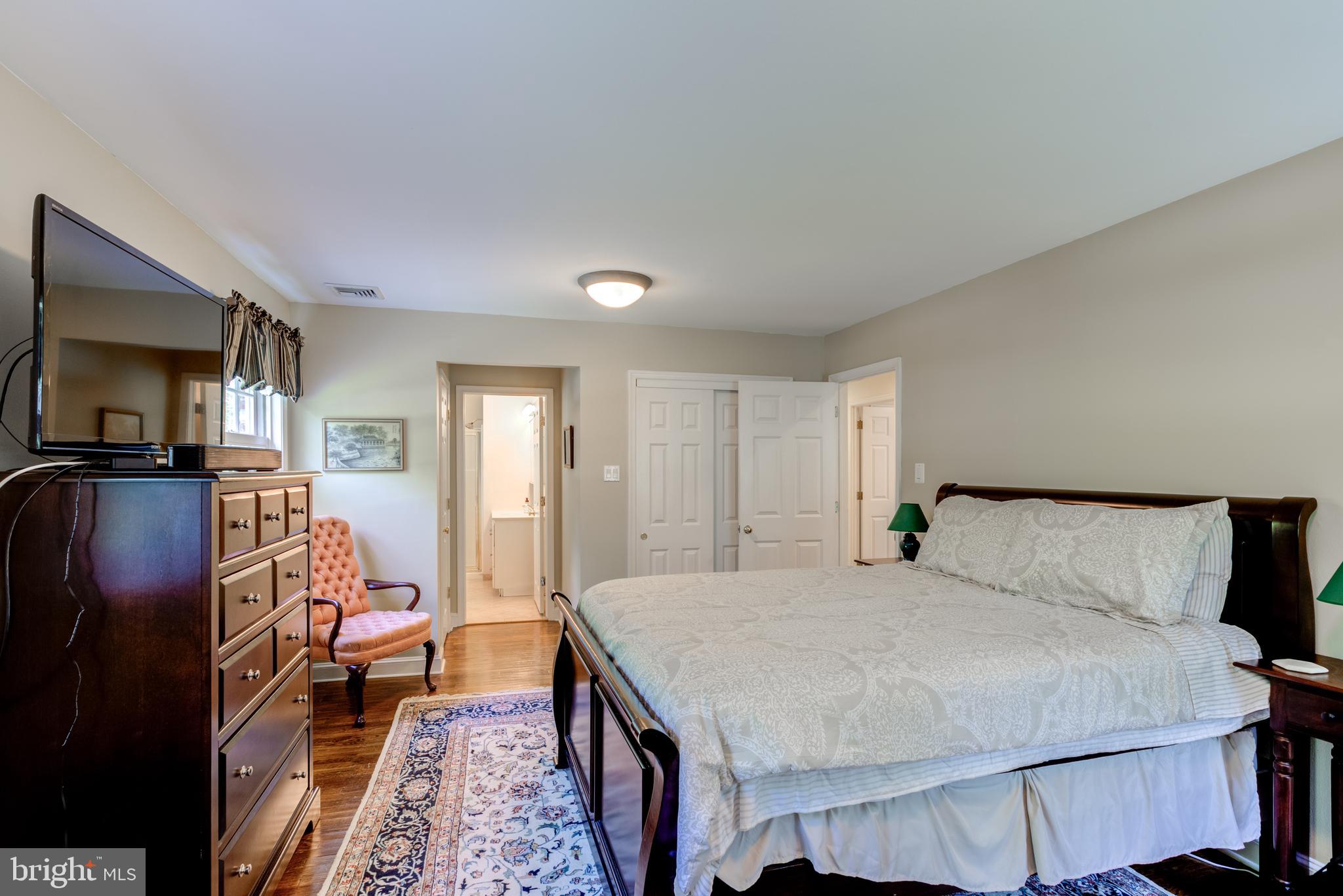 420 Accomac Road Wyncote, PA 19095 - Photo 44 of 82 a bedroom with a bed and wooden floor