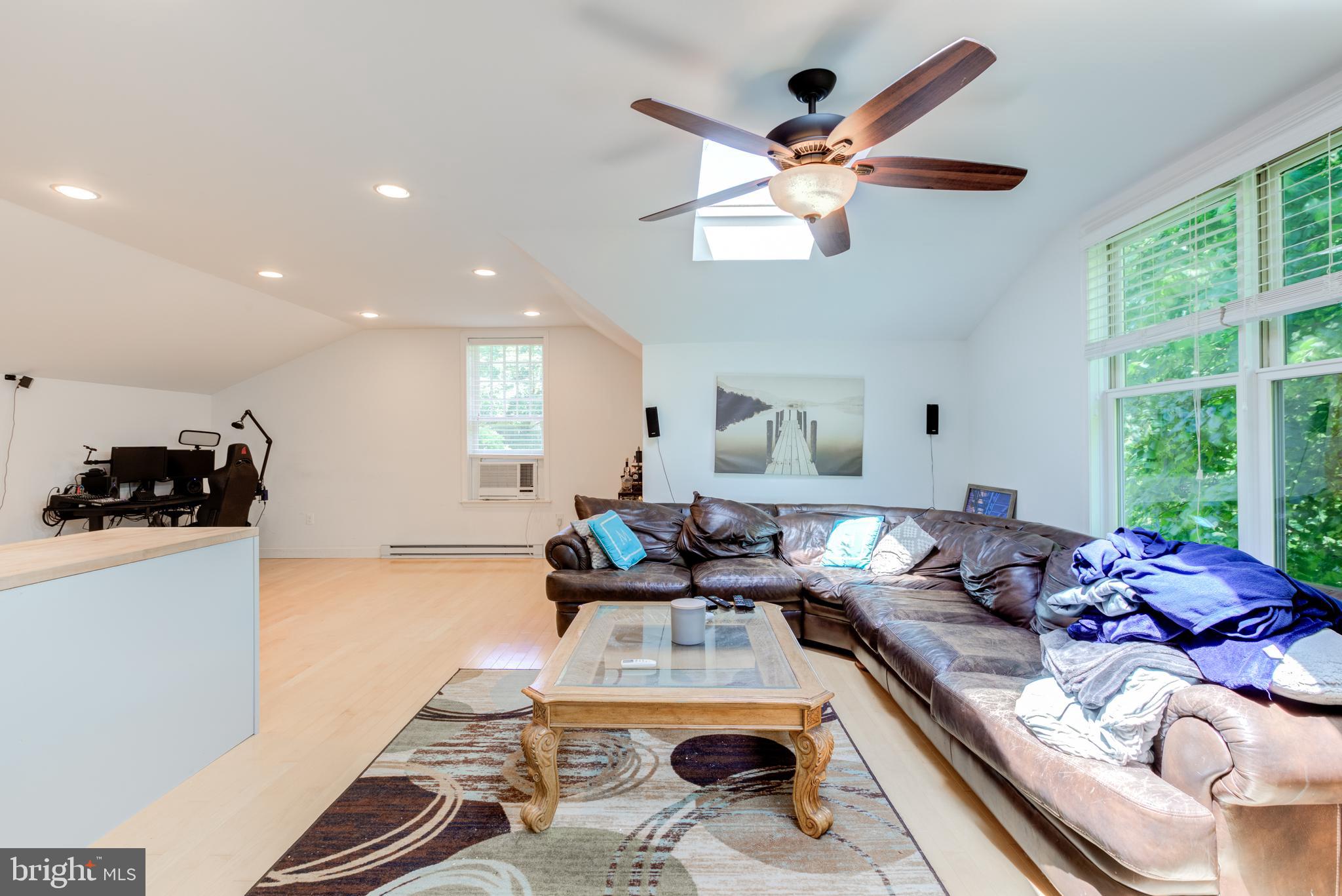 420 Accomac Road Wyncote, PA 19095 - Photo 70 of 82 a living room with furniture and a large window