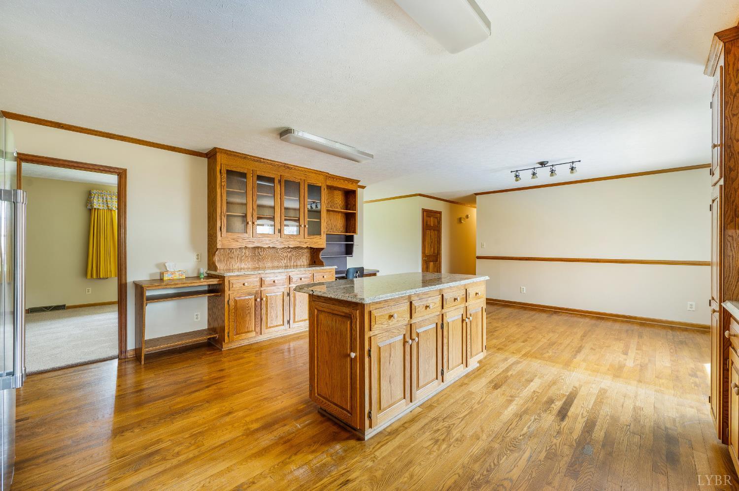 129 Quail Ridge Drive Altavista, VA 24517 - Photo 13 of 76 a kitchen with stainless steel appliances granite countertop a stove a sink and a refrigerator