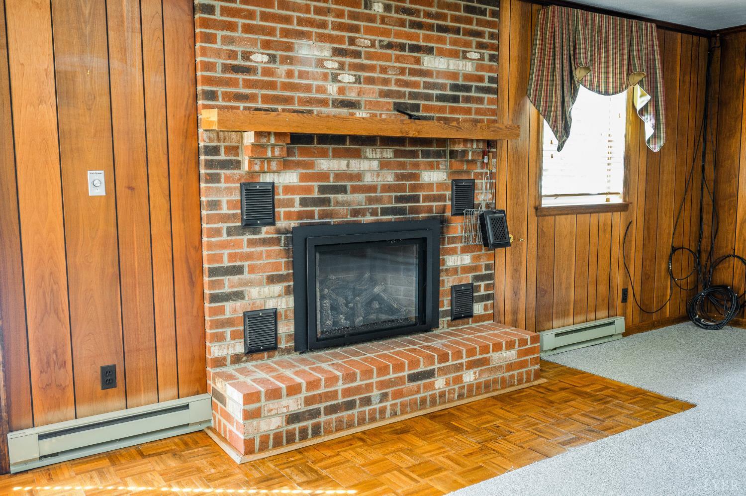 129 Quail Ridge Drive Altavista, VA 24517 - Photo 35 of 76 a living room with a fireplace windows