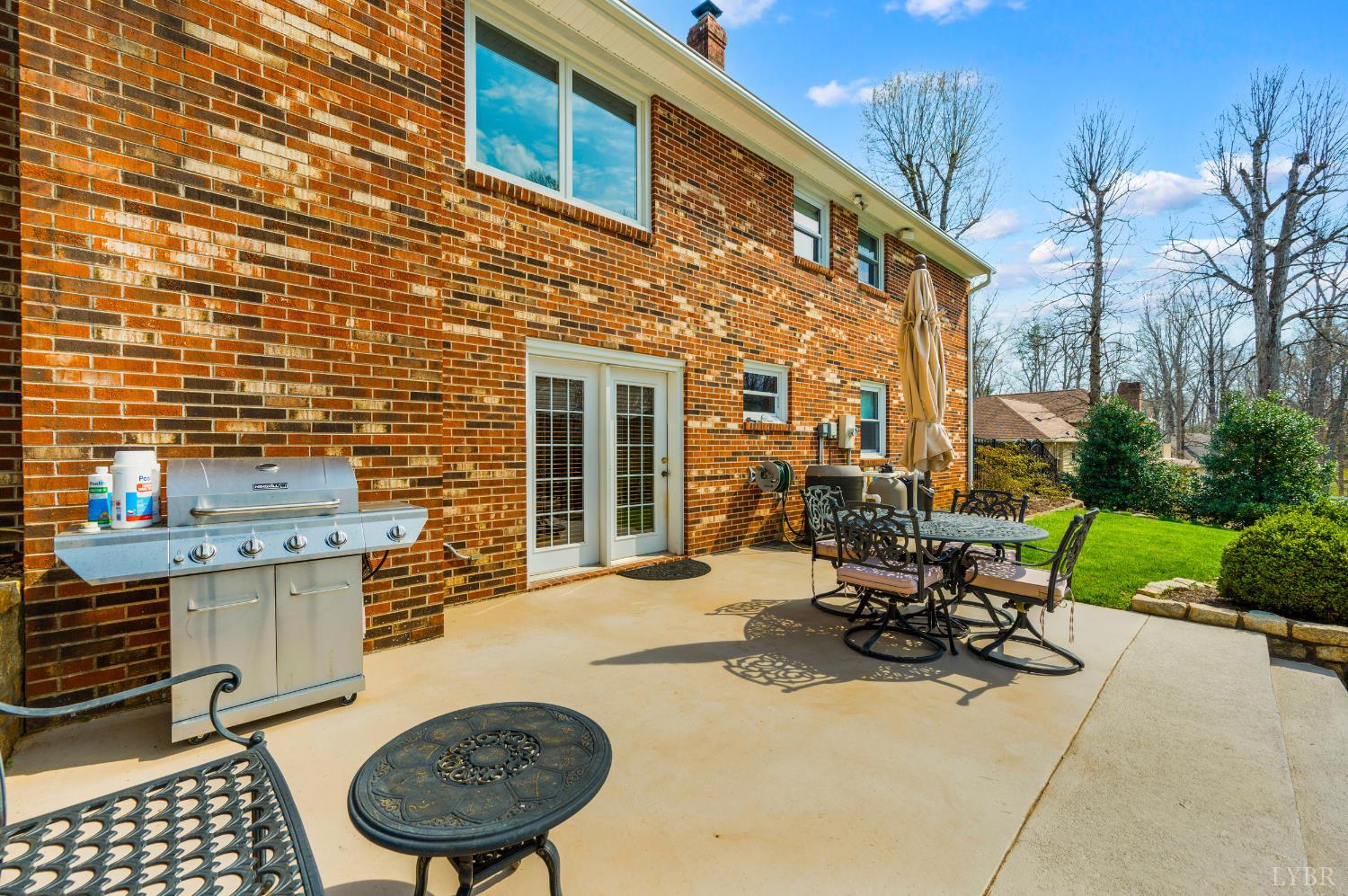 129 Quail Ridge Drive Altavista, VA 24517 - Photo 46 of 76 a view of a chairs and tables in the patio