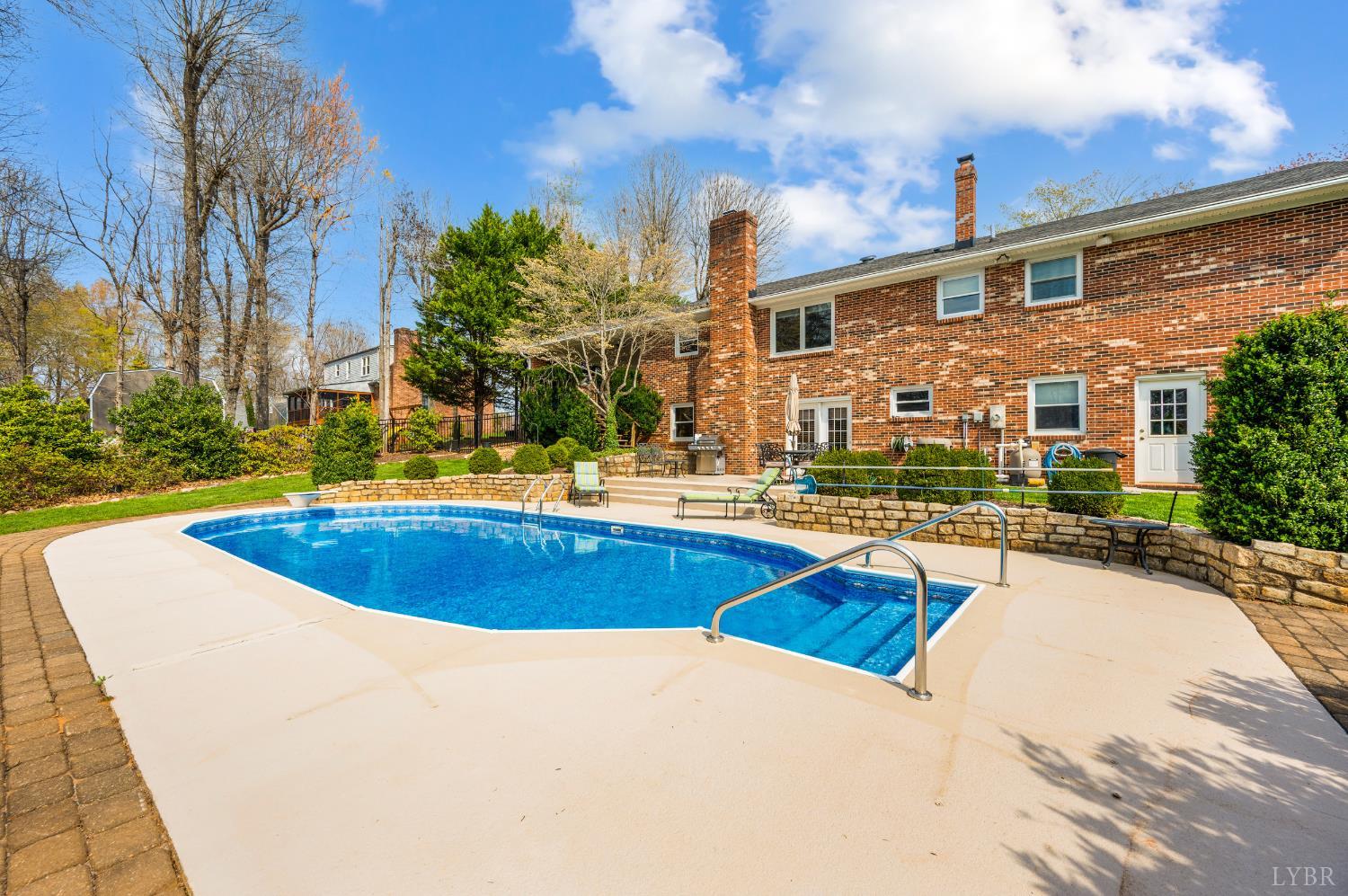 129 Quail Ridge Drive Altavista, VA 24517 - Photo 49 of 76 a view of swimming pool with outdoor seating and yard in back