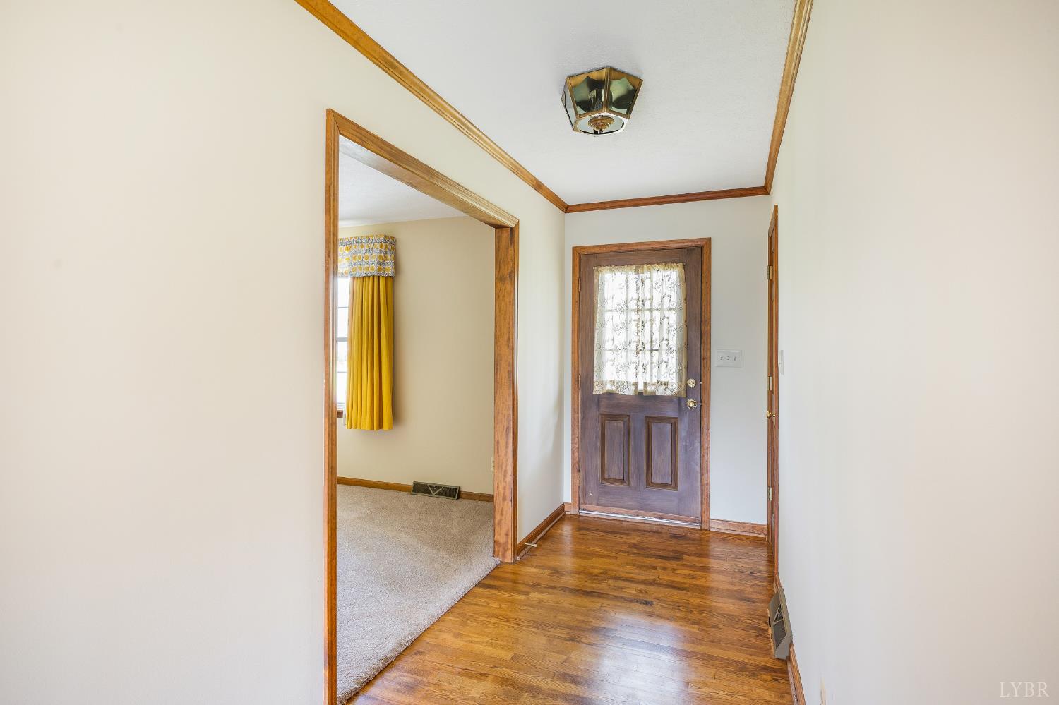 129 Quail Ridge Drive Altavista, VA 24517 - Photo 5 of 76 a view of a hallway with wooden floor and a bathroom