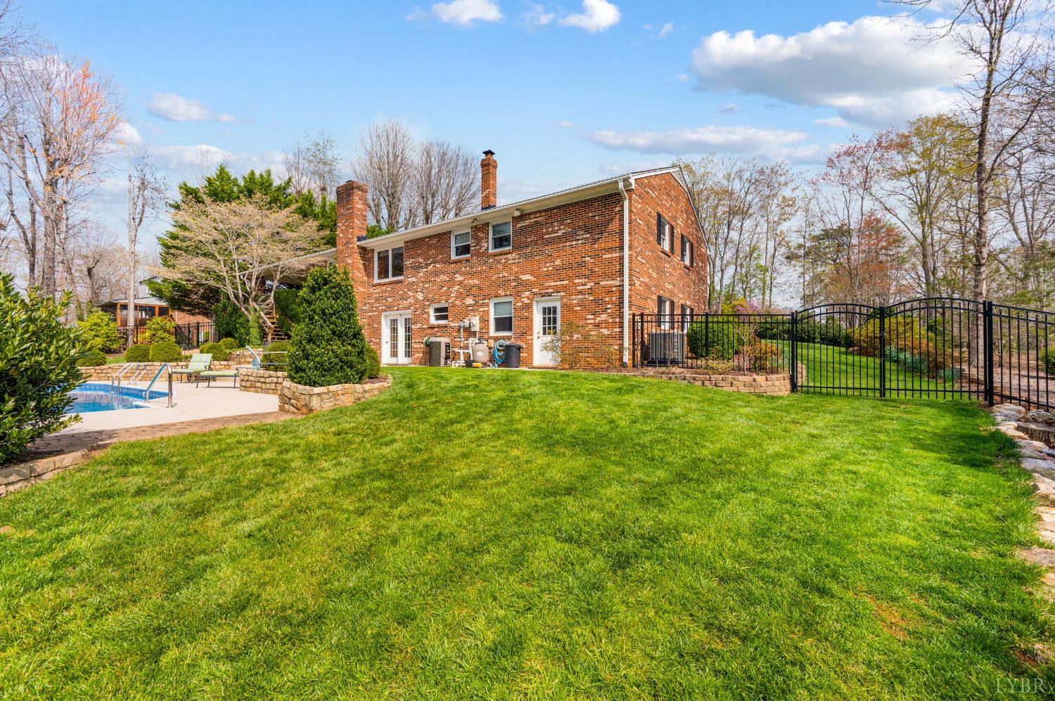 129 Quail Ridge Drive Altavista, VA 24517 - Photo 53 of 76 a garden with trees in front of it