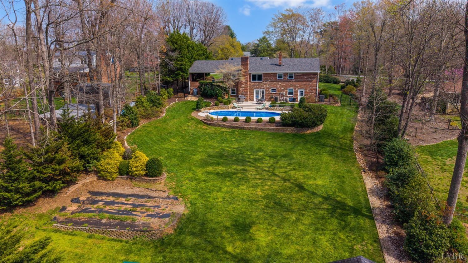 129 Quail Ridge Drive Altavista, VA 24517 - Photo 54 of 76 a aerial view of a house with a garden and trees