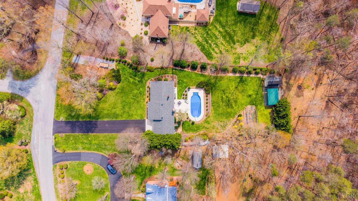129 Quail Ridge Drive Altavista, VA 24517 - Photo 73 of 76 a view of a yard with plants and large trees