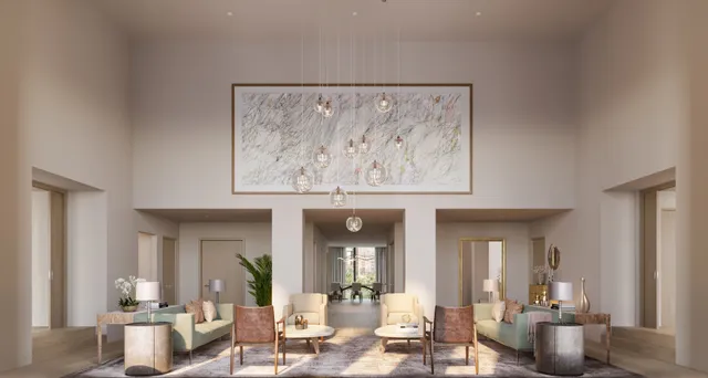 a view of a living room filled with furniture and a painting