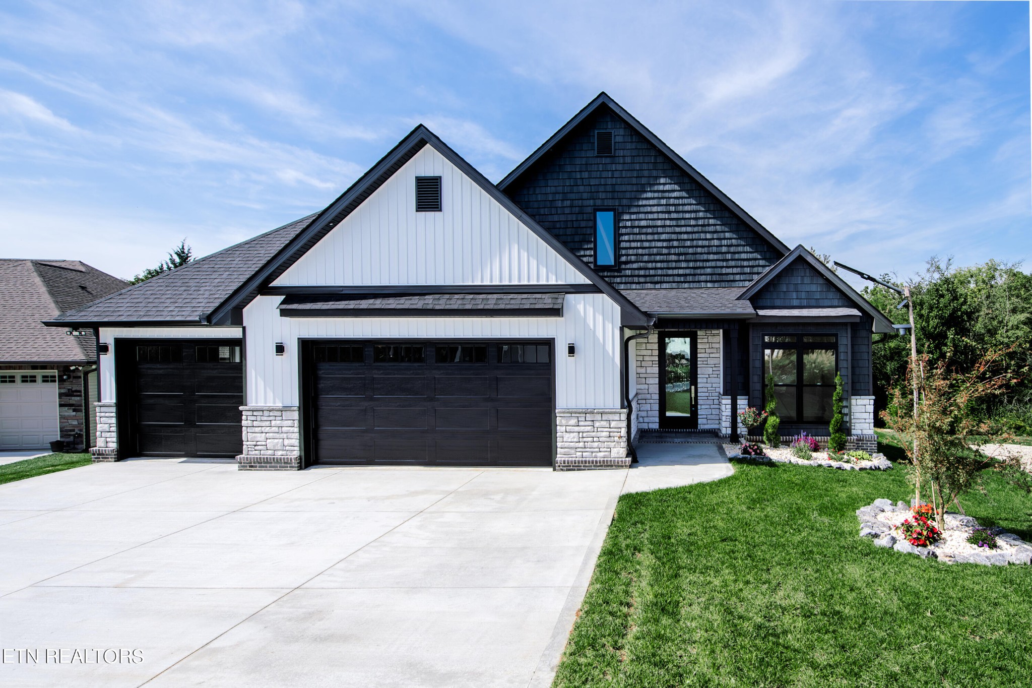 a front view of a house with garden
