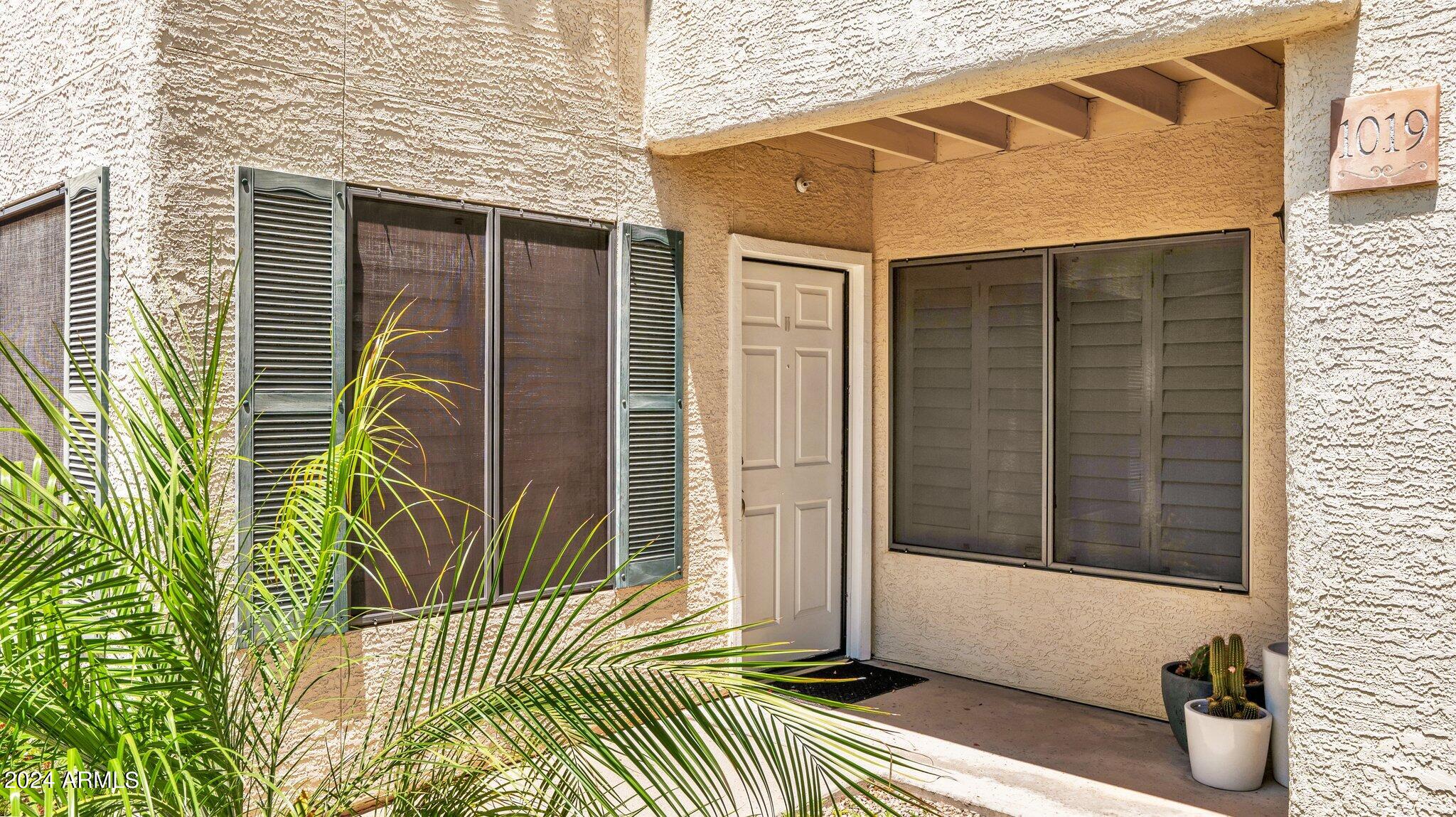 9990 North Scottsdale Road, Unit 1019 Paradise Valley, AZ 85253 - Photo 4 of 30 a view of a house with a door and wooden floor