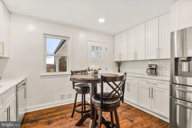 a kitchen with a sink cabinets and window
