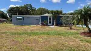 a backyard of a house with seating space