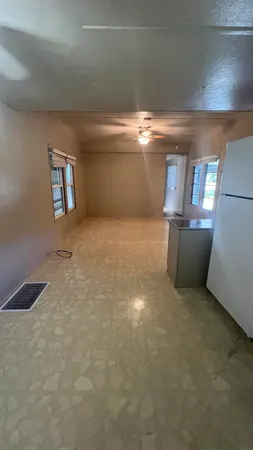 a view of an empty room and window
