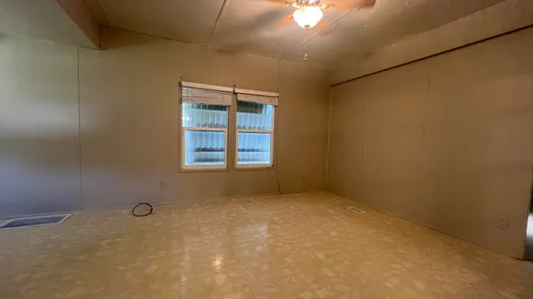 an empty room with windows
