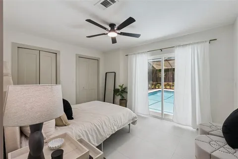 a view of a swimming pool with a patio