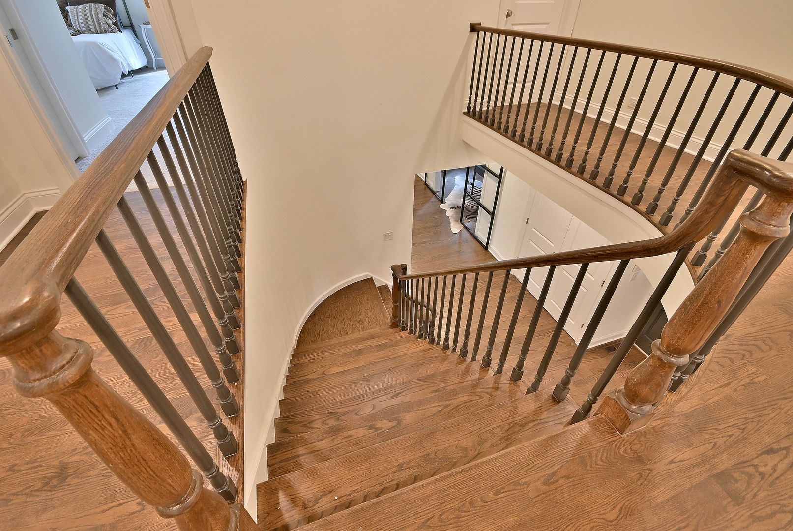 13 Woodgate Drive Burr Ridge, IL 60527 - Photo 29 of 46 a view of staircase with white walls a small space and wooden floor