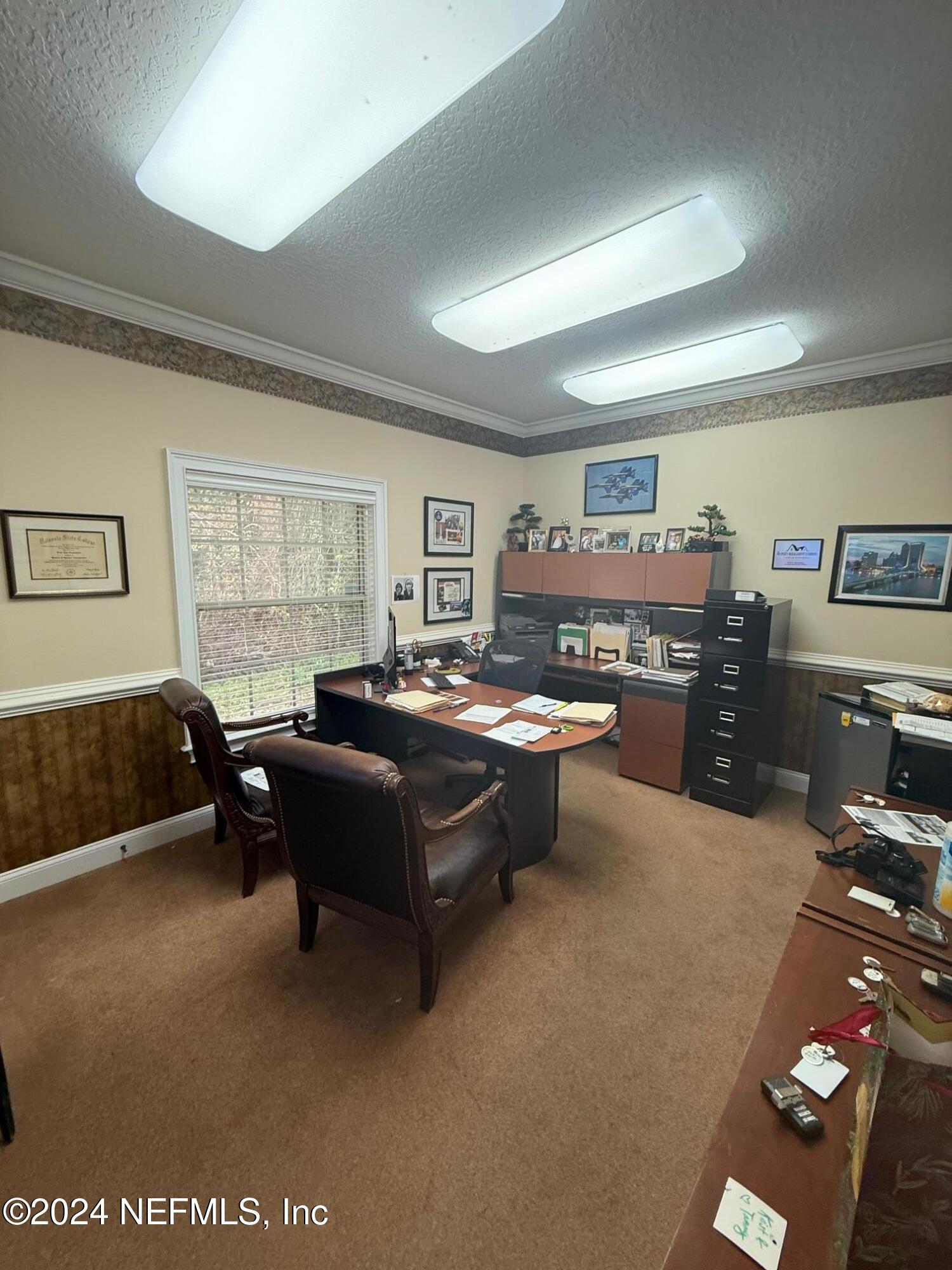 9310 Old Kings Road South, Unit 1101 Jacksonville, FL 32257 - Photo 11 of 13 a living room with furniture window and dresser