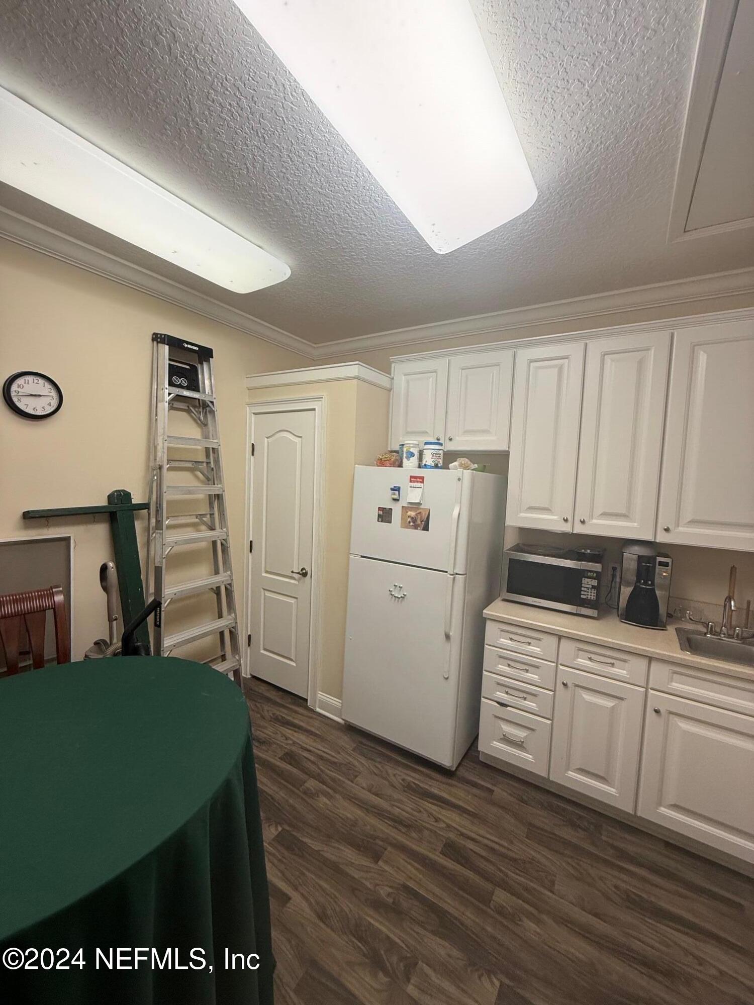 9310 Old Kings Road South, Unit 1101 Jacksonville, FL 32257 - Photo 13 of 13 a room with sink a washer and dryer