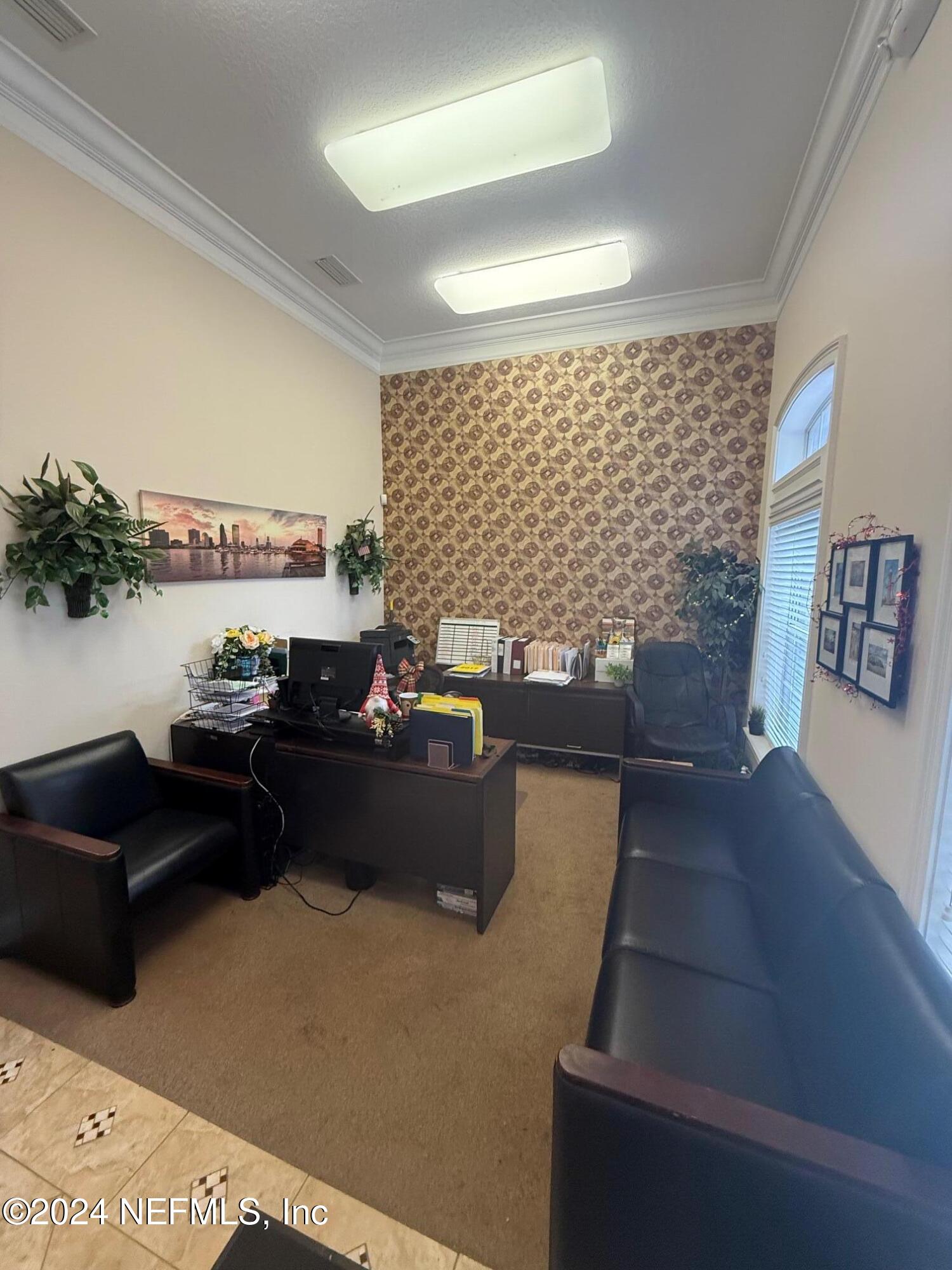 9310 Old Kings Road South, Unit 1101 Jacksonville, FL 32257 - Photo 4 of 13 a living room with furniture