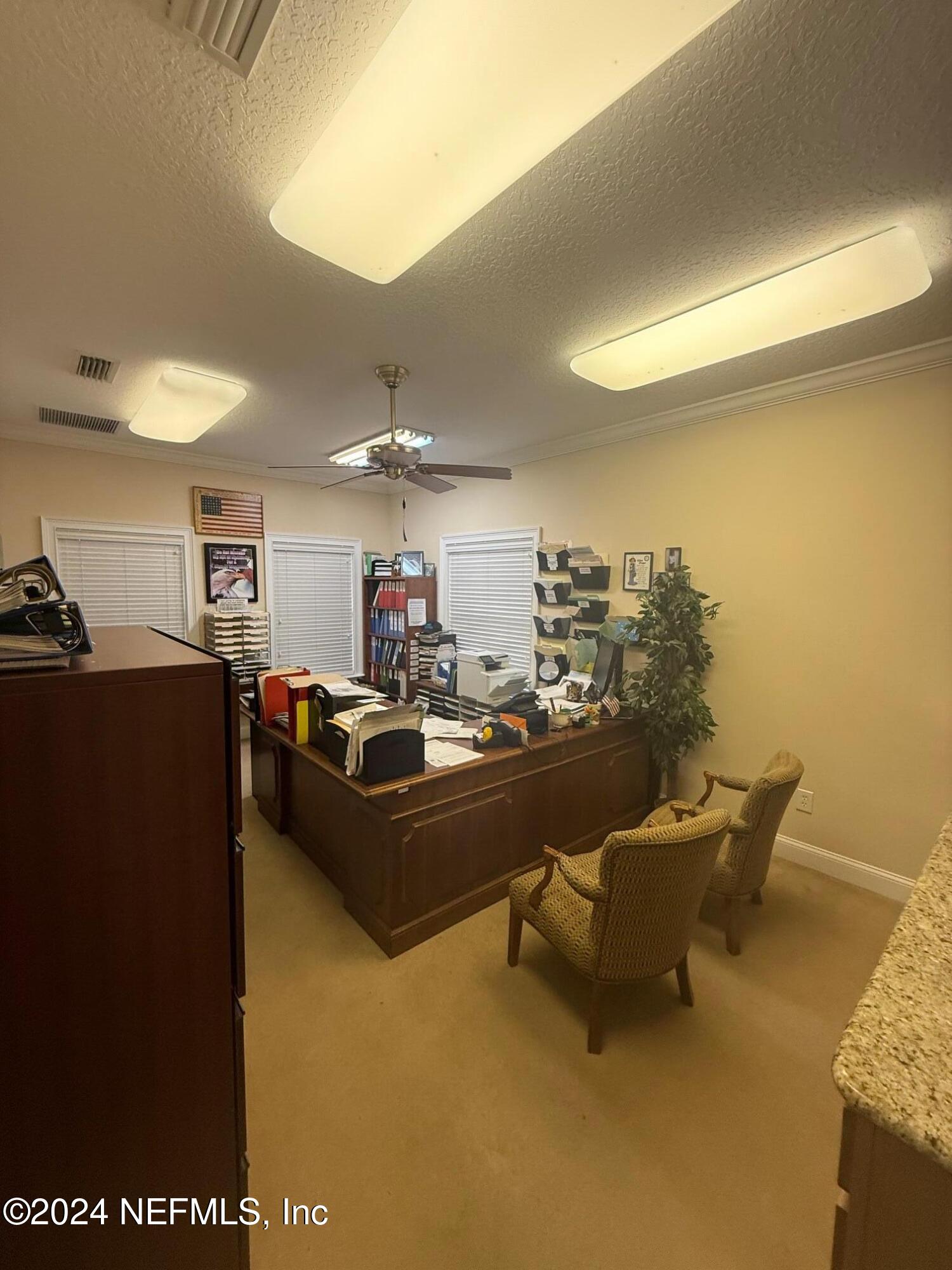 9310 Old Kings Road South, Unit 1101 Jacksonville, FL 32257 - Photo 7 of 13 a living room with furniture and a table