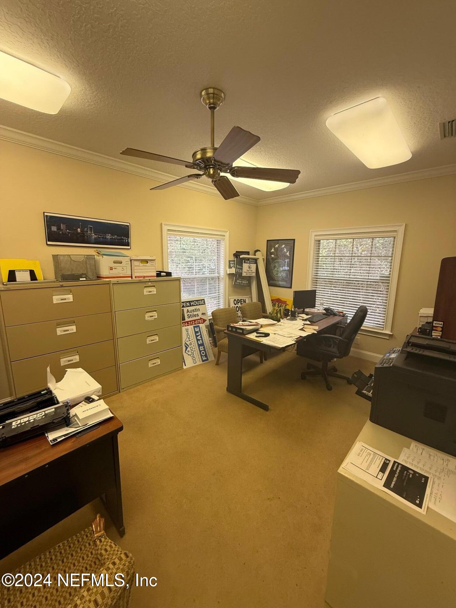 9310 Old Kings Road South, Unit 1101 Jacksonville, FL 32257 - Photo 9 of 13 a view of a workspace with furniture