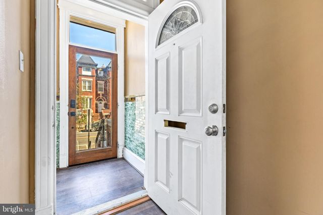 a living room with furniture fireplace and flat screen tv