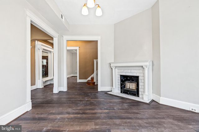 a kitchen with stainless steel appliances granite countertop a sink a stove and cabinets