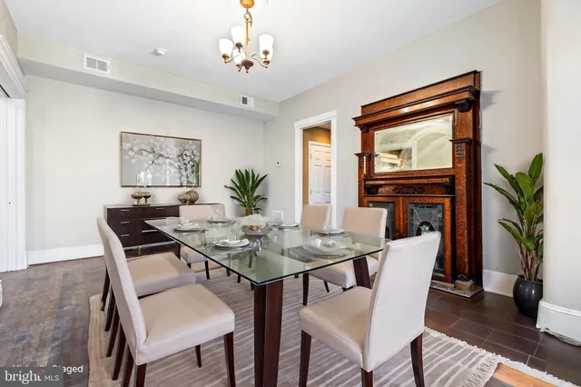 a view of a hallway with paintings on the wall