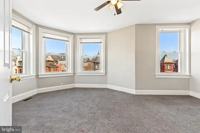 a view of an empty room with a window