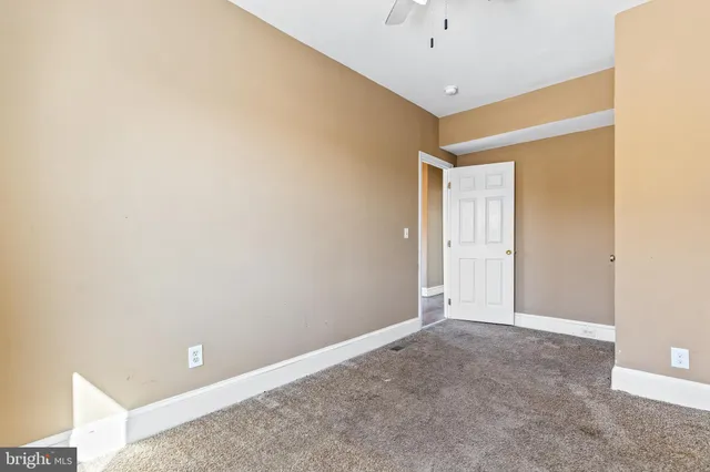 a front view of a house with a basket ball court