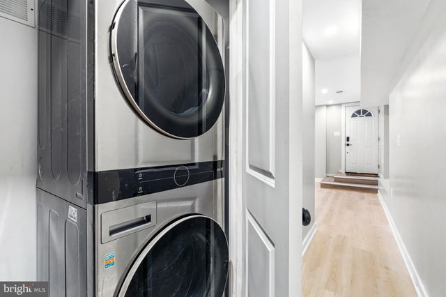 a bedroom with a bed and a potted plant