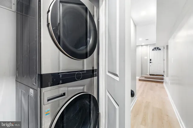 a bedroom with a bed and a potted plant