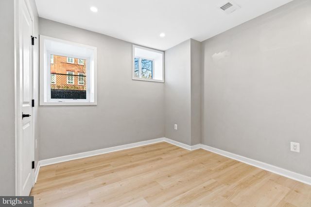 a bathroom with a toilet sink shower and mirror