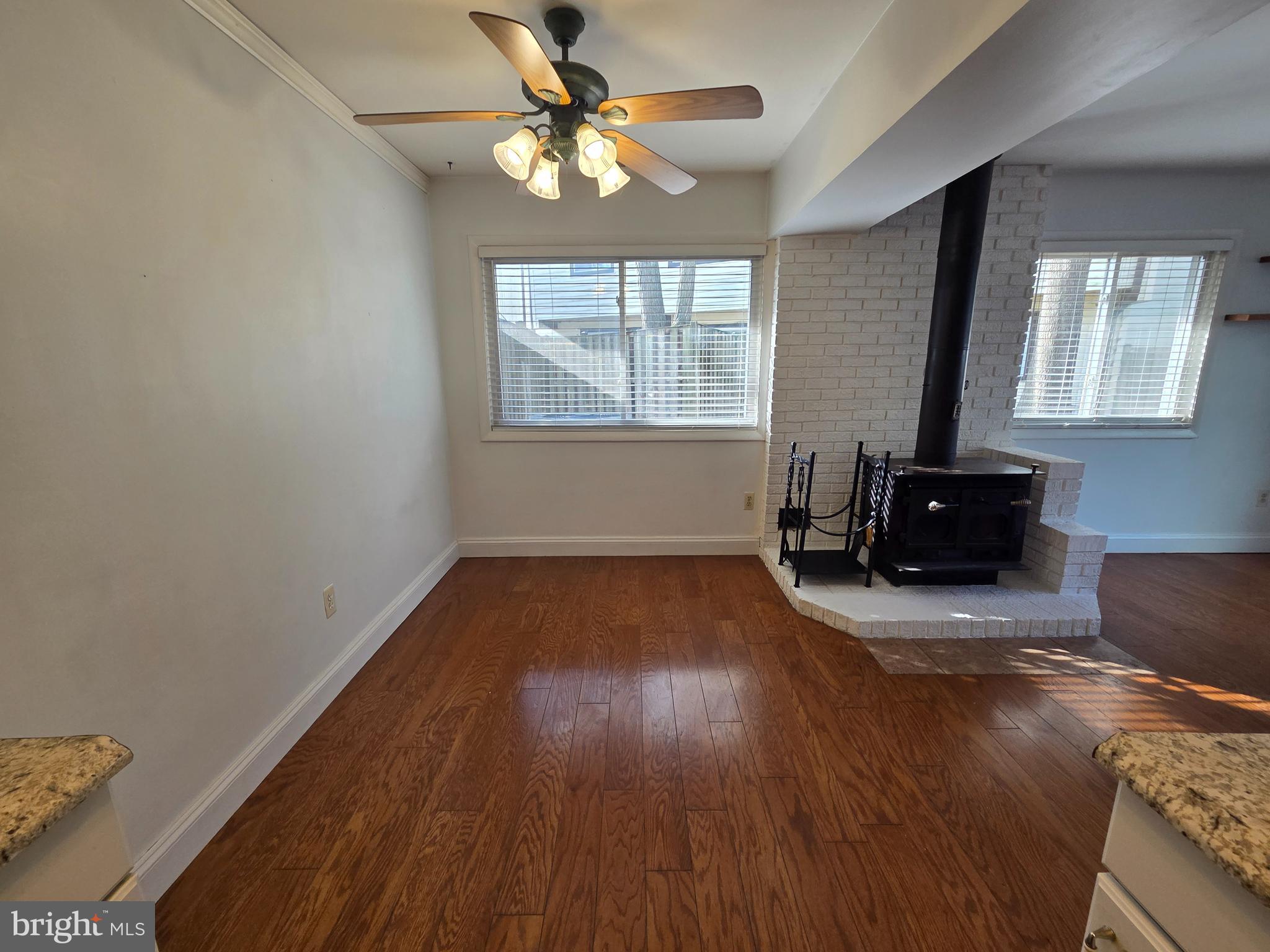 1729 Leisure Way Crofton, MD 21114 - Photo 12 of 20 wooden floor in an empty room with a window