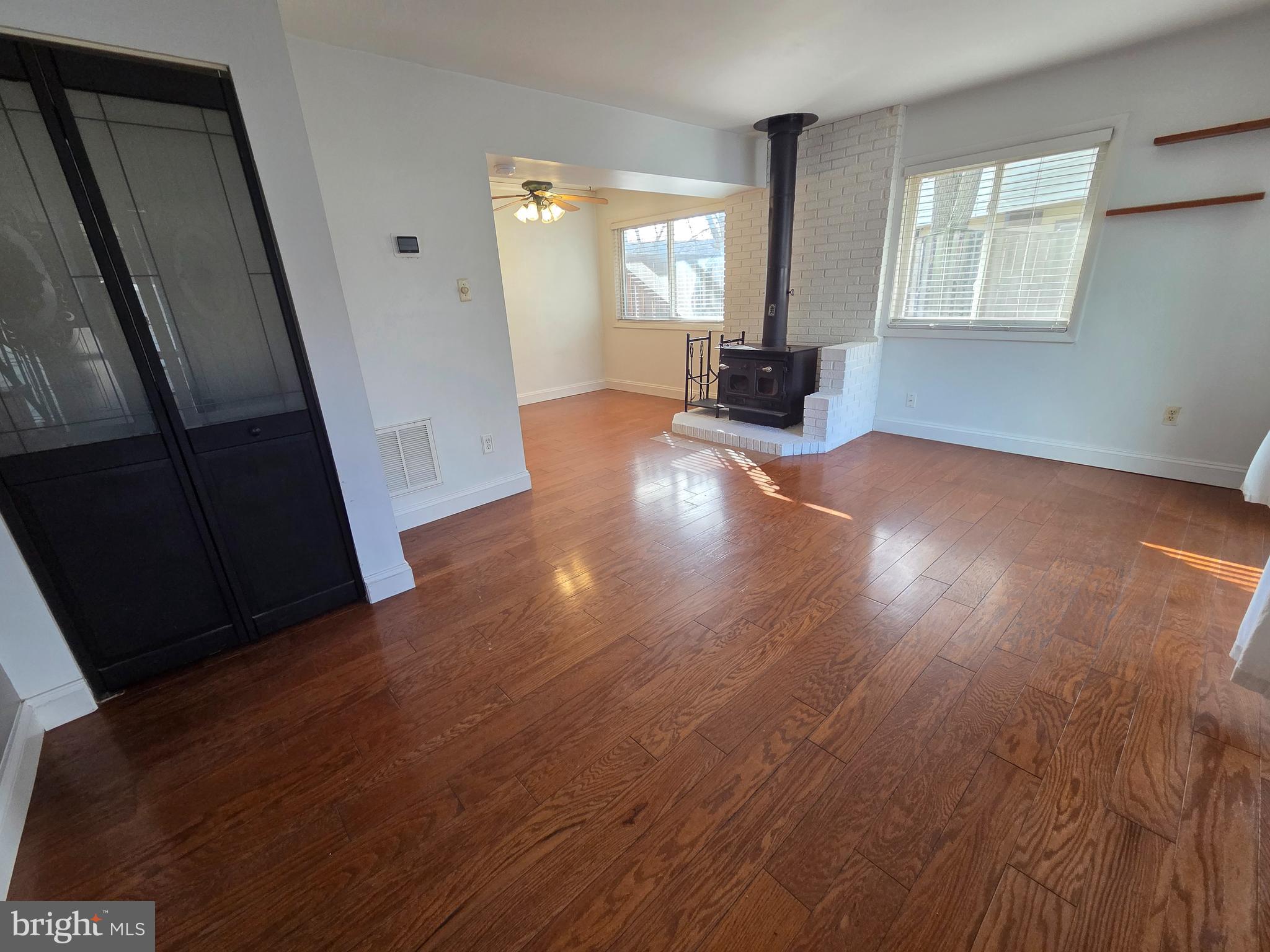 1729 Leisure Way Crofton, MD 21114 - Photo 15 of 20 an empty room with wooden floor and windows