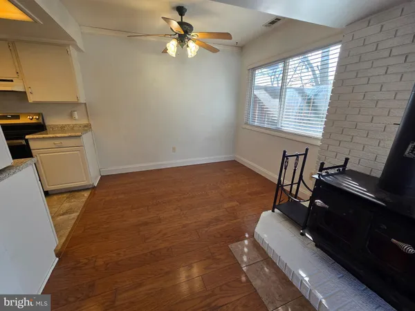 a kitchen with stainless steel appliances granite countertop a refrigerator sink and stove