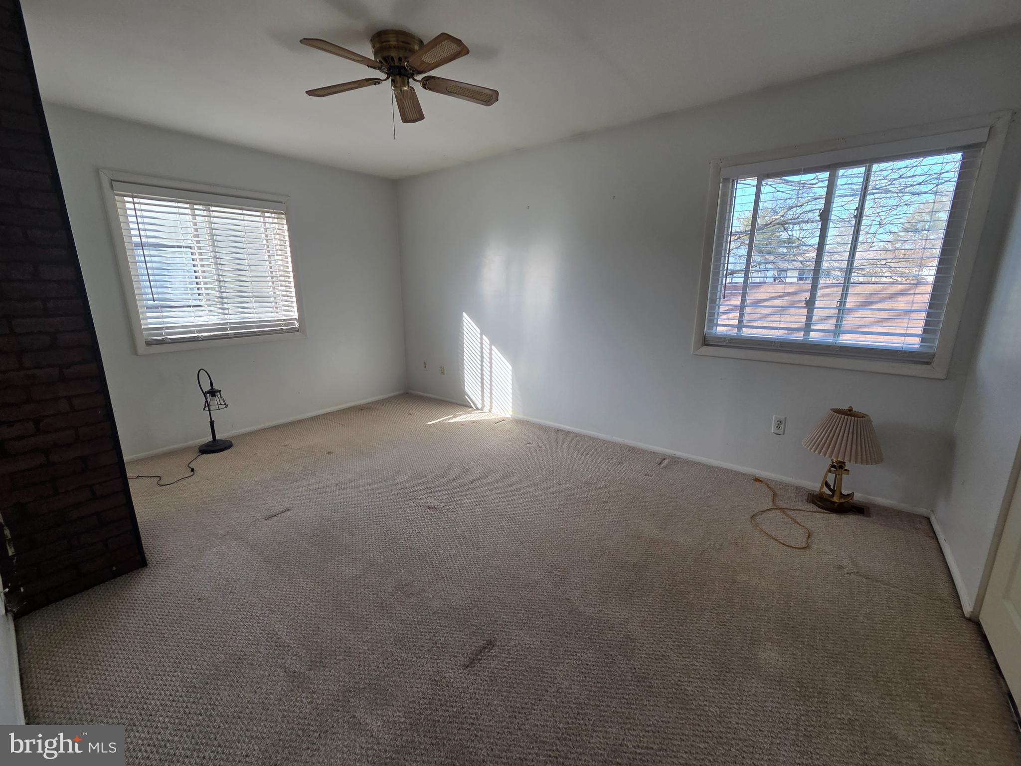 1729 Leisure Way Crofton, MD 21114 - Photo 7 of 20 an empty room with windows and fan