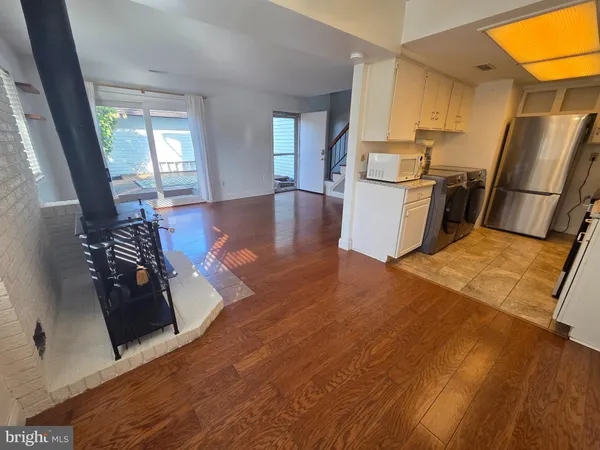 a view of an entryway with wooden floor