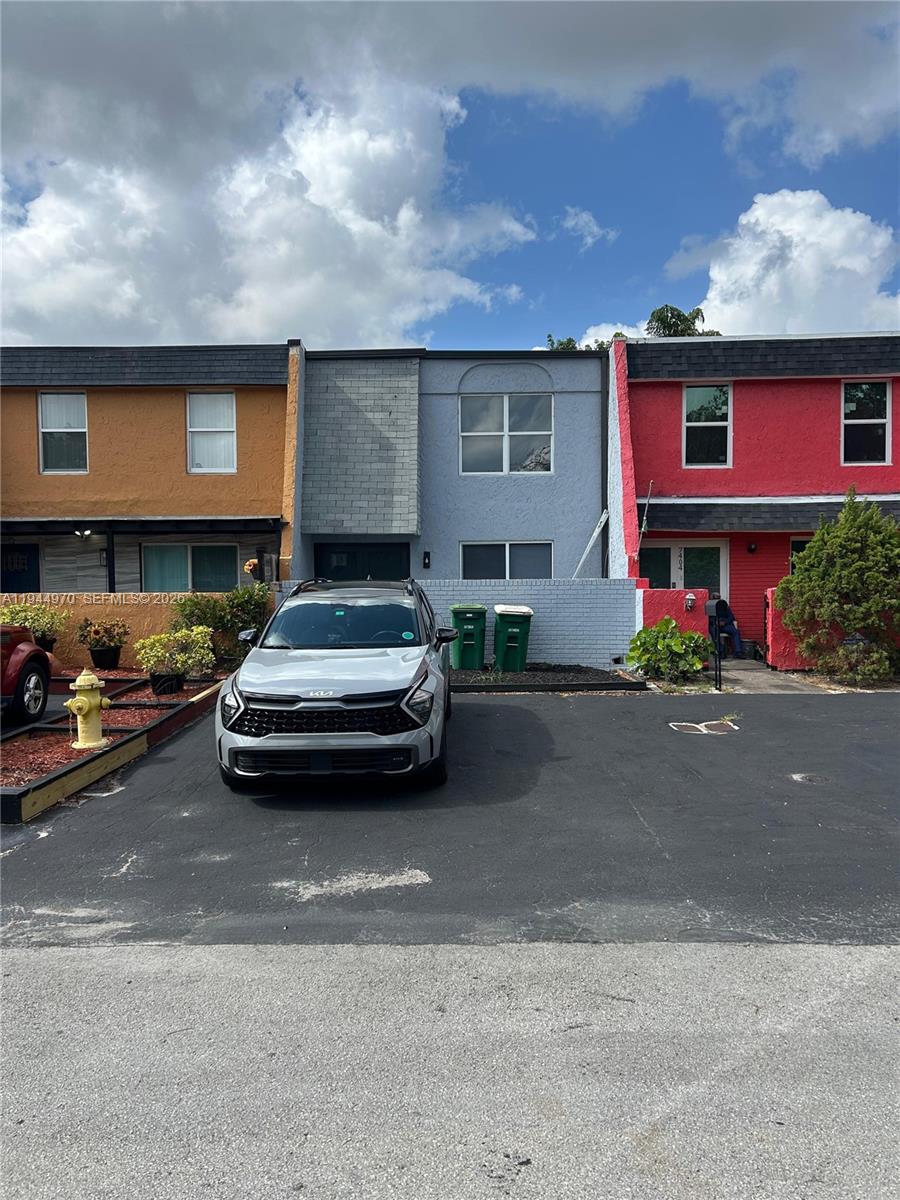 a car parked in front of a house