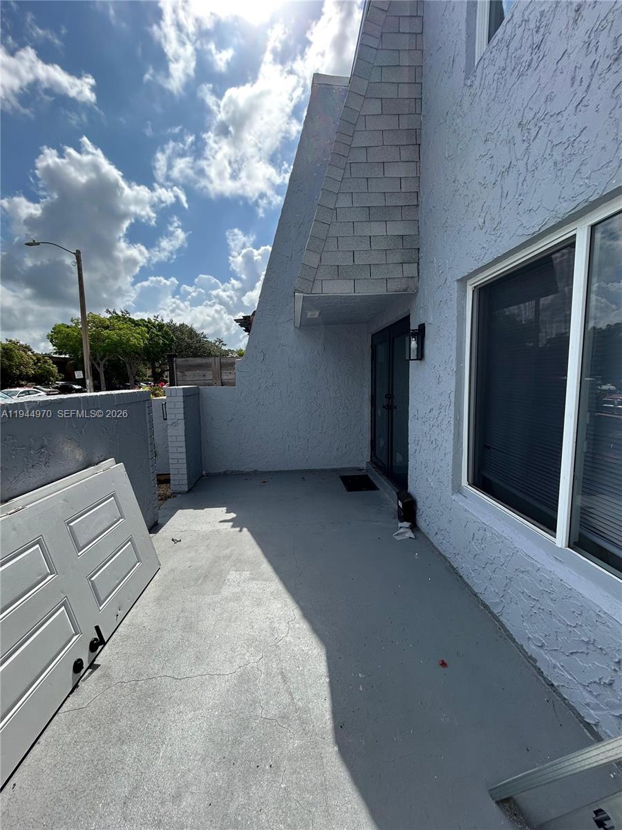 7402 Northwest 75th Street Tamarac, FL 33321 - Photo 11 of 38 a view of backyard with mountain view and wooden floor
