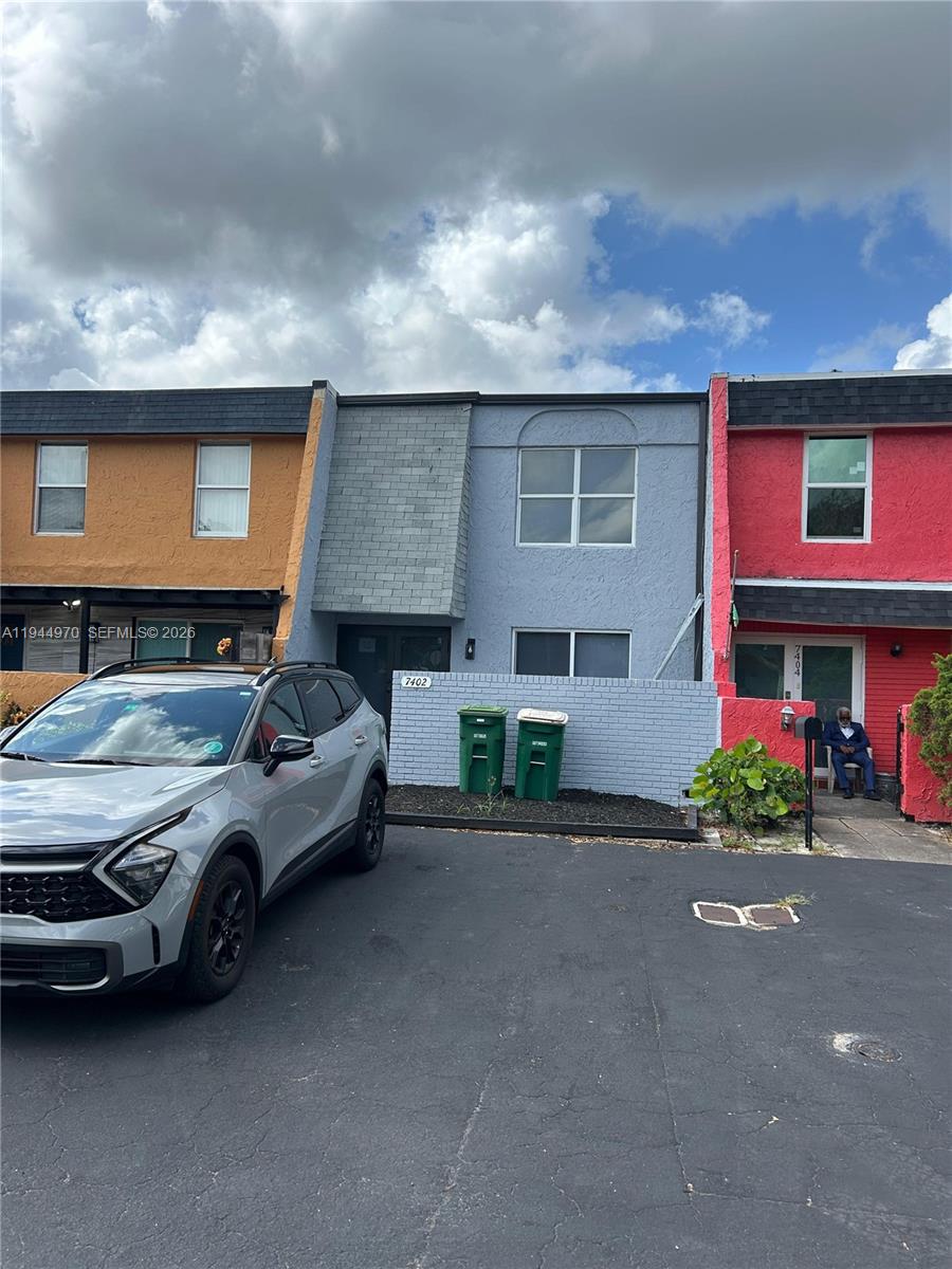 7402 Northwest 75th Street Tamarac, FL 33321 - Photo 20 of 38 a car parked in front of a house